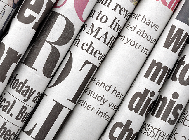 rolled newspapers